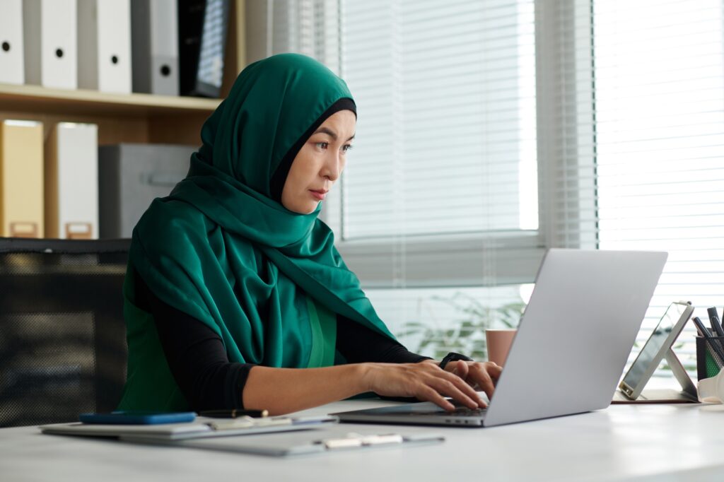 Muslim Woman Working on Laptop